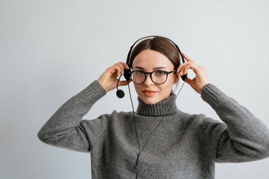 Woman putting on headphones